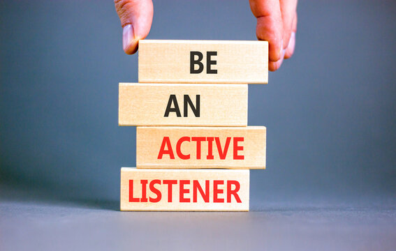 Be an active listener words symbol. Concept words Be an active listener on beautiful wooden blocks. Beautiful grey background. Businessman hand. Business be an active listener concept. Copy space.
