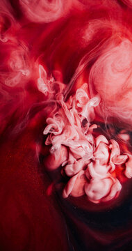 Turbulence paint. Pigment splash. Sparkling cloud color spray particles flow liquid. Red white fume abstract twirl mix blur background.