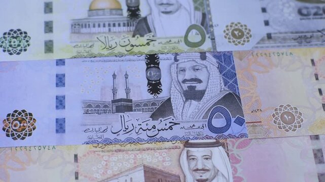 Saudi Arabia paper money, riyal banknotes and coins as currency for exchange or travel. Saudi Arabia money as a business background