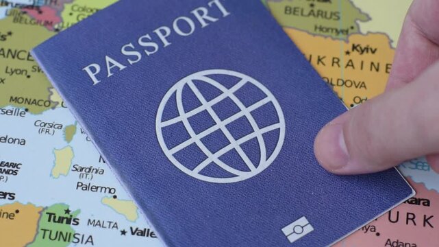 International passport against a map backdrop, representing the concepts of travel, hiking, and relocation. Passport on a map as a background for your design
