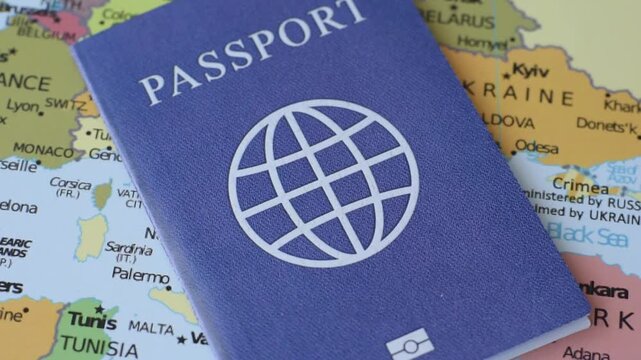 International passport against a map backdrop, representing the concepts of travel, hiking, and relocation. Passport on a map as a background for your design