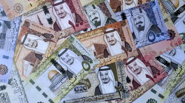 Saudi Arabia paper money, riyal banknotes and coins as currency for exchange or travel. Saudi Arabia money as a business background
