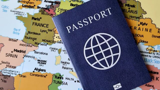 International passport against a map backdrop, representing the concepts of travel, hiking, and relocation. Passport on a map as a background for your design