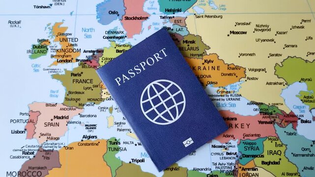 International passport against a map backdrop, representing the concepts of travel, hiking, and relocation. Passport on a map as a background for your design