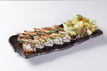 Fresh salmon sushi roll with sauce on white plate © Donghyun Kim