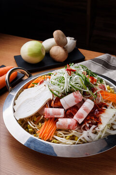 Korean hot pot jeongol with meat vegetables and rice cake in lar