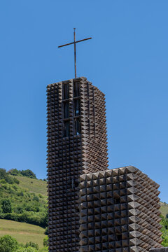 A vertical low angle view of the modernist architecture and stone diamond-pointed facade of the Sanctuary of Arantzazu basilica in Onati, Basque Country, Spain.