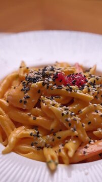 Italian pasta with salmon and caviar. Close up High quality FullHD footage