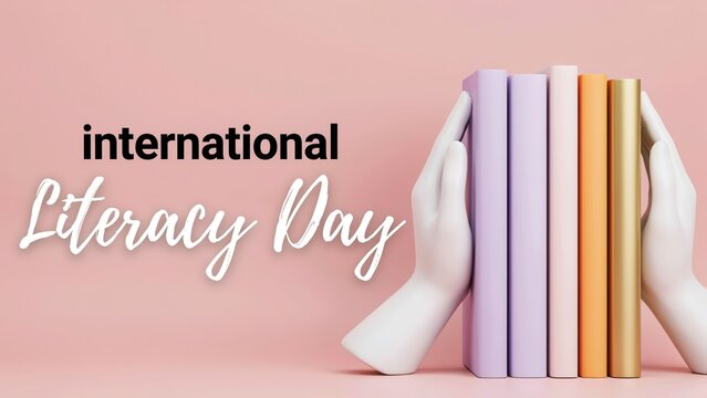 International Literacy Day concept with books held by hand bookends on a pink background