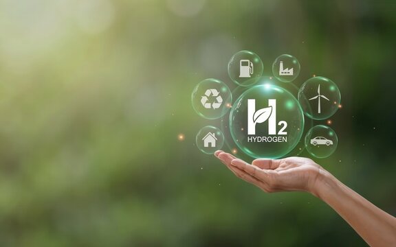 Hand holding a glowing green hydrogen bubble with icons representing sustainable energy and industry