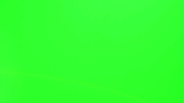Green screen background provides a uniform chroma key surface that is essential for professional video editors to replace the backdrop with custom digital environments or effects during.