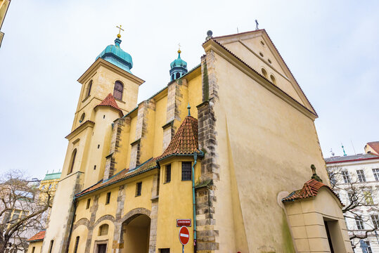 Exterior view of the historic Church of the Holy Spirit (Kostel svateho Ducha) showcasing its unique architectural details in the UNESCO World Heritage site of Prague.
