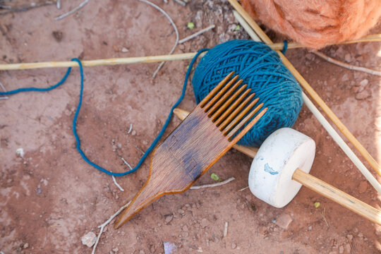 Wooden Comb with Blue Yarn