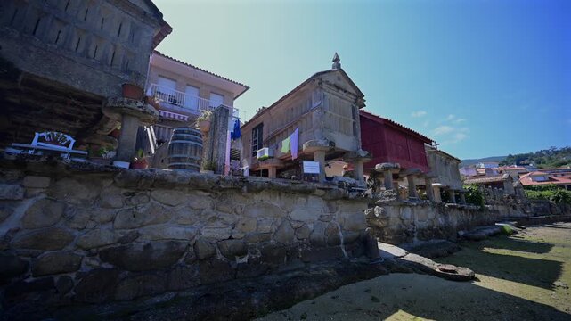 Traditional Granite H&oacute;rreos and Coastal Architecture along the Narrow Streets of Combarro in Poio, Galicia, Spain
