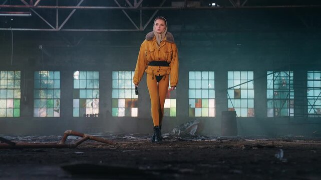 Futuristic Woman in Dystopian Industrial Warehouse Wearing Cyberpunk Fashion