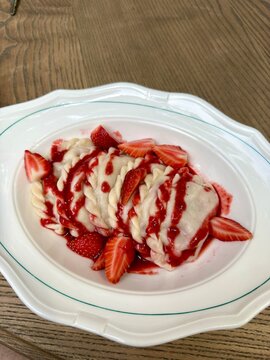 Traditional Sweet Dumplings with Fresh Strawberries and Strawberry Sauce