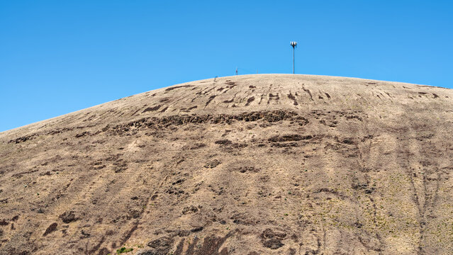 Panorama of a cell phone tower atop a barren hill near Heppner, Oregon, USA