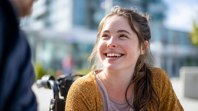 Happy girl with disability sitting in wheelchair, lifestyle.
