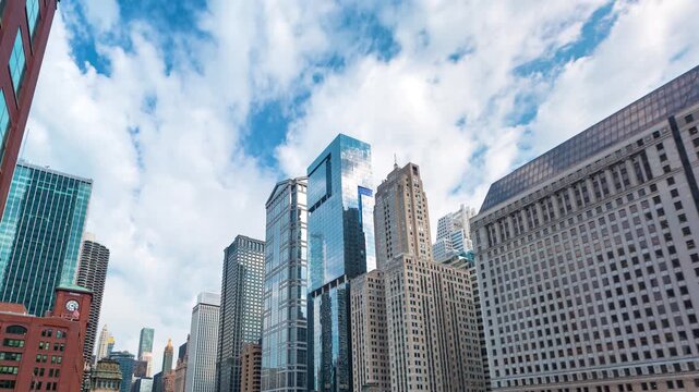 Chicago Skyline Timelapse 4k Low Angle View of Dynamic Cloud Movement over Glass Skyscrapers and Modern Urban Architecture During Bright Sunny Daytime City Atmosphere