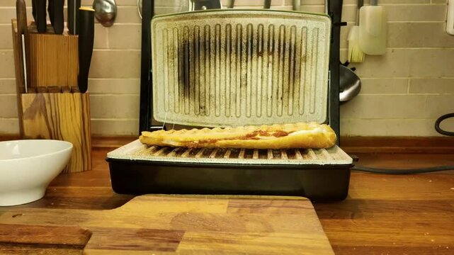 Grilling a delicious panini sandwich in a kitchen appliance