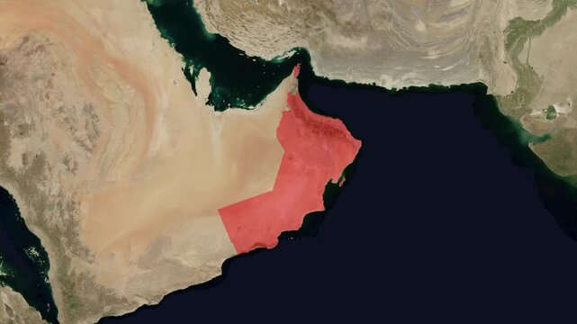 Animation of a satellite map zooming in on Oman in the Arabian Peninsula, highlighting national borders in red for geographic visualization.