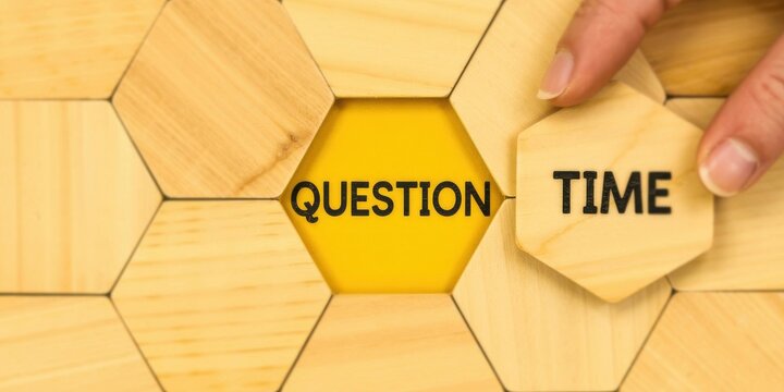 Wooden hexagon puzzle pieces with the words question time