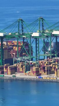 Aerial view of a busy container terminal with cargo activity