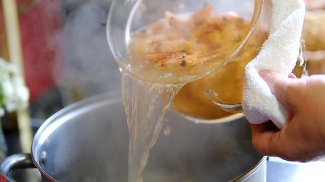 Seafood cooking process with shrimp and blue crab boiled in pot then served on plate as fresh homemade seafood meal close up