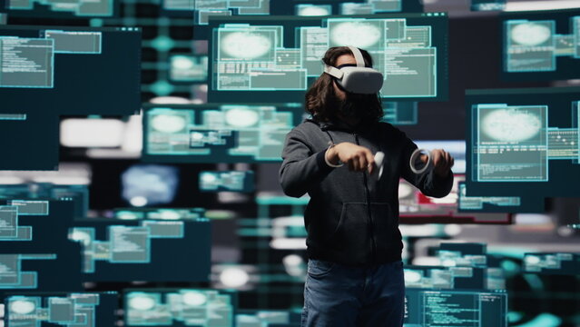 Spy uses VR glasses to bypass network security and conduct cyber intrusion, programming code for data breach, identity theft and covert digital infiltration operations.