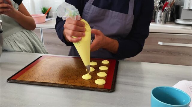 Making macaroon cookies, preparing dough for baking in the oven