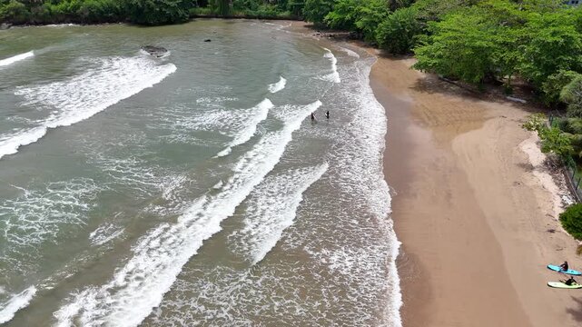 Galle, Sri Lanka, November 3, 2025: Devata Beach in the galle city and surfers riding in the waves