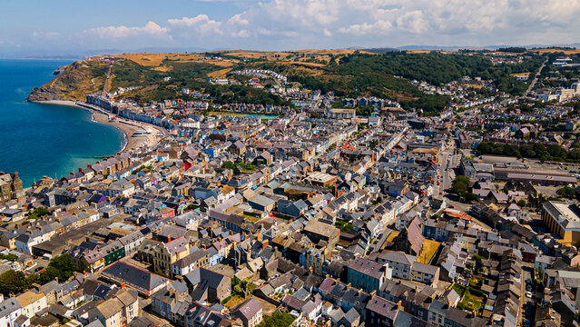 Aerial panorama of Aberystwyth town landscape seafront and constitution hill