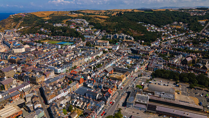 Fototapeta premium Aerial view of Aberystwyth town landscape rooftops and hill