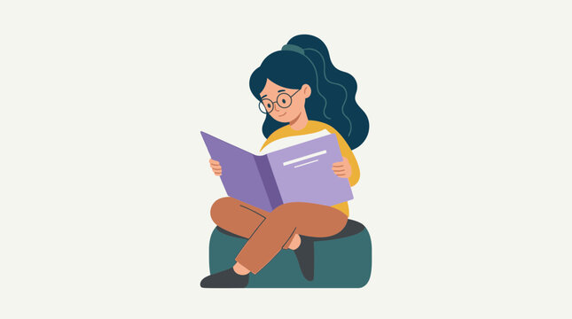Young Girl Reading a Book While Sitting on a Beanbag Chair