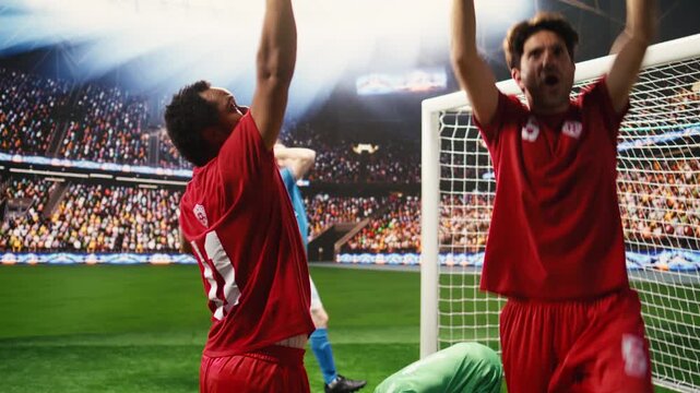 Football celebration after match winning goal as goal scorer raises arms, smiling and celebrating with clenched fists, excitement on pitch after final whistle, winning soccer game.