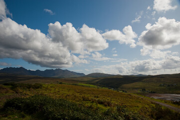 Fototapeta premium Panoramic View of the Cuillin Mountains Under Dramatic Clouds, Isle of Skye, Scotland