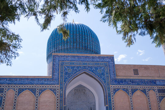 Blue Tiled Dome and Ornate Facade of Historic Mosque in Samarkand