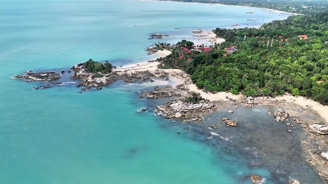 Spectacular Aerial View of Teluk Karang Beach Bangka with Turquoise Waters, Granite Formations, Tropical Forest and White Sandy Coastline Paradise