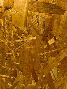 Close up of oriented strand board wood texture featuring engineered timber surface for construction and design backgrounds