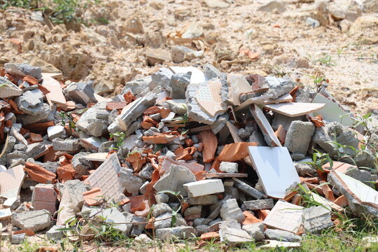 Large pile of broken bricks, concrete, and rubble from building demolition and reconstruction