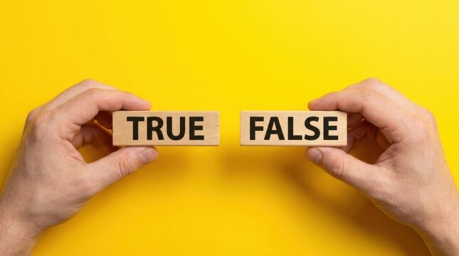 Hands holding wooden blocks labeled true and false on yellow background with verification information validation education with text
