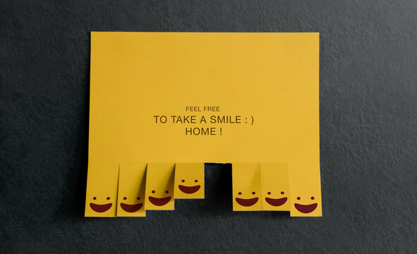 Yellow note with smiling faces.kindness, emotional support, empathy, sharing happiness