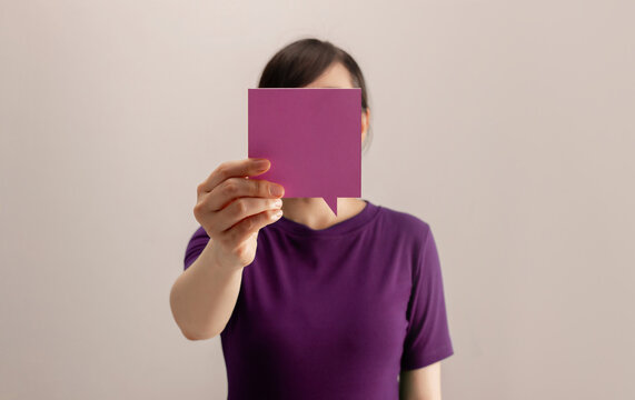 Woman holding a blank square card, communication, identity, messaging