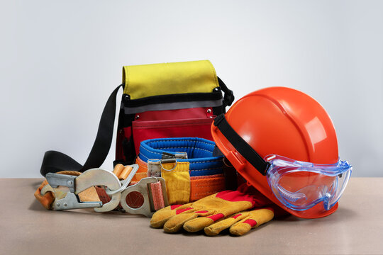 Work safety protection equipment on grey background.