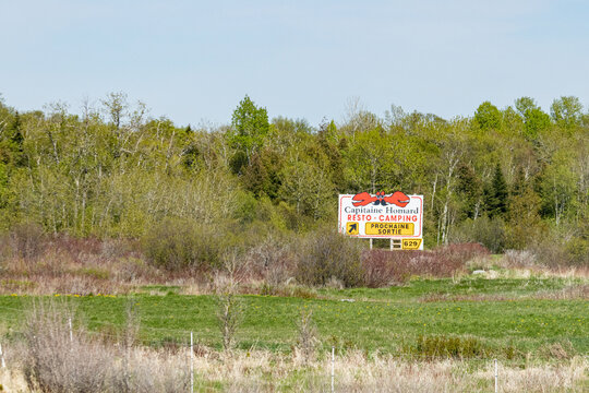 Gaspesie, Canada, 30 May 2026 : A roadside sign for Capitaine Homard Restaurant and Camping directs travelers to the next exit.