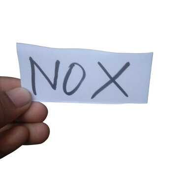 A person holding a small white paper note with the word nox written on it isolated on transparent background