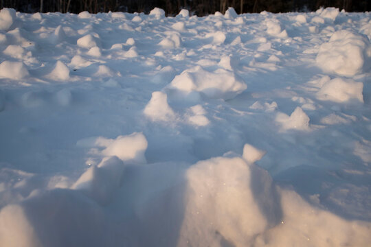 Sun shining on clumps of snow