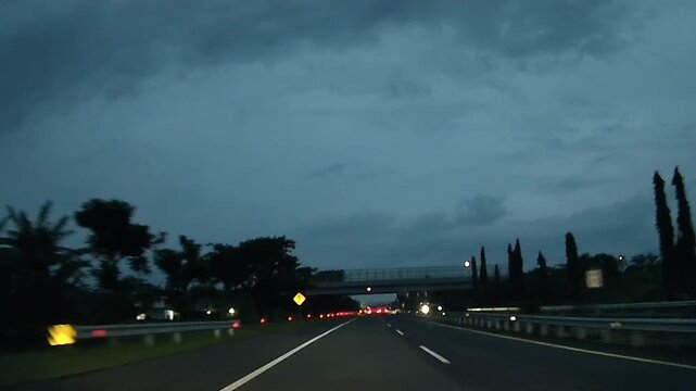 Driving Toward Malang on Pandaan&ndash;Malang Toll Road During Evening Blue Hour, East Java, Indonesia