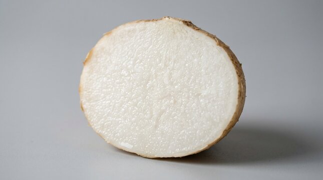 Fresh yam root section with textured interior and outer skin