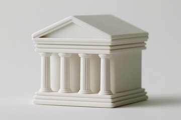 Obraz premium Miniature White Classical Building Model with Columns on a White Background